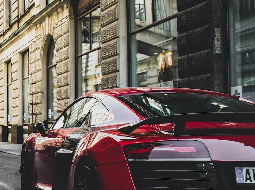 red vehicle on the road